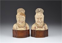 PAIR OF PAINTED POTTERY TANG GUARDIAN HEADS
