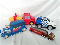Metal fire truck & 3 plastic toy trucks