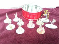 10 glass animal figurines on mirrors with tin can