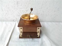 Wood coffee grinder with copper color metal top