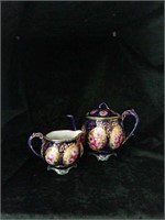 Hand painted teapot and creamer