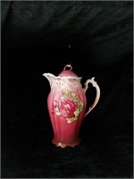 Vintage porcelain teapot with rose motif