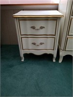 Ivory and gold colored night stand