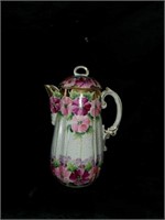 Vintage porcelain teapot with pansies