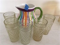 striped pitcher an glasses