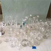 large assortment of stemmed glassware