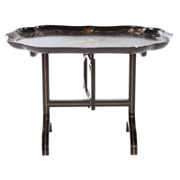 Floral painted ebonized tray-top folding tea table