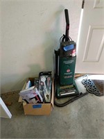 Hoover vacuum cleaner and box of model airplanes