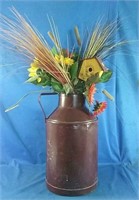 dry flower arrangement in antique milk can