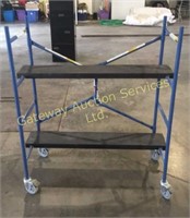 Small scaffolding on casters with two metal