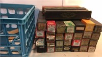Large assortment of music rolls with crate