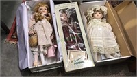 Three porcelain dolls in the boxes, 15 inches