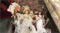 Six porcelain dolls about 16 inches tall it in a