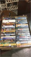 About 60 DVDs in a box, (834)