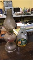 Vintage oil lamp with a bottle of fuel about 1/3