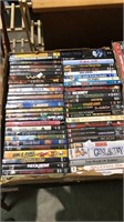 About 56 DVDs in a box (834)