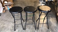 Three black barstools with metal bases, 24 inch