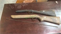 Two rifle stocks and a steel rod with burs for