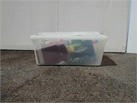 Clear plastic container w/ misc contents