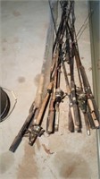 Large lot of fishing poles, one new