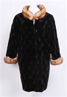A 3/4-LENGTH MINK COAT WITH FOX COLLAR AND CUFFS