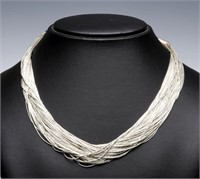 A MULTI-STRAND STERLING BUGLE BEAD NECKLACE