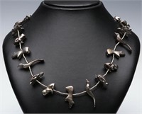 A STERLING SILVER FETISH NECKLACE