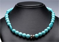 A TURQUOISE BEAD NECKLACE