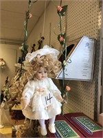 MENIE SWINGING PORCELAIN COLLECTOR DOLL