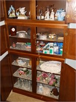 Contents of 6 shelves: bird figurines, ceramic