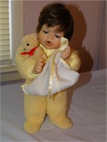 Porcelain boy doll in yellow pajamas w/ bear &