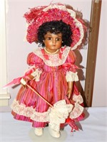 Dolls of Yesteryear porcelain doll - red dress w/