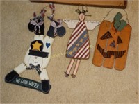 3 wooden holiday signs: snowman, patriotic angel,