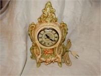 Porcelain electric clock, movement by Anshire