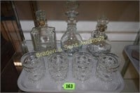 TRAY OF 3 WHISKEY DECANTERS AND 4 CRYSTAL ROCKS
