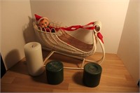 Wicker sleigh with elf and candles