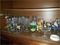 Long Shelf of Glassware with Coke glasses,