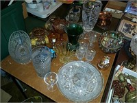 Tabletop full of assorted glassware including cut