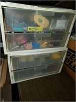 4 drawer storage unit full of assorted toys and