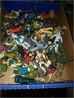 Box full of action figures including GI Joe and