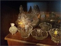 Shelf of nice glass and crystal decor, feat hen