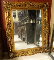 Grand Gilt Rococo Style Beveled Mirror.