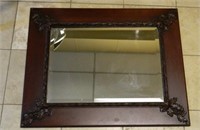 Beveled Wall Mirror with Foliate Accented Frame.