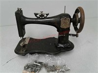 Antique sewing machine with accessories