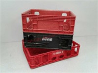3 plastic Coca-Cola pop crates
