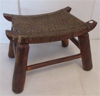 Stool featuring woven top and hickory legs.