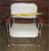 Aluminum deck chair with vinyl upholstery and a