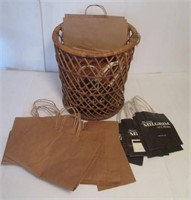 Rattan basket with paper shopping bags. Many are