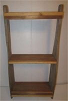 Shelf unit made from old paddles. Measures 34" h