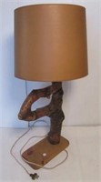 Rustic table lamp made from a tree branch.